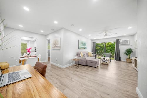 a living room with a table and a couch at Bayview Regency Apartments By Lowkl in Fort Lauderdale