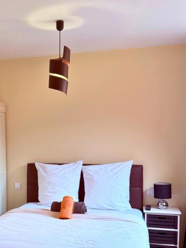 a bedroom with a bed with a stuffed animal on it at Auberge Alpina in Gréolières