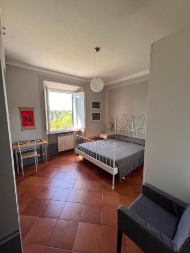 Ένα ή περισσότερα κρεβάτια σε δωμάτιο στο Toscana in Città - Ampio APT immerso nella natura