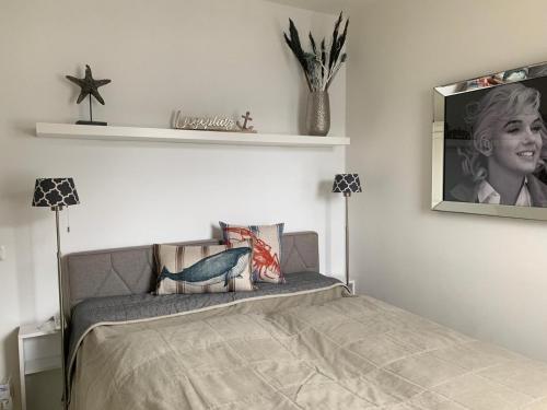 Ένα ή περισσότερα κρεβάτια σε δωμάτιο στο Little Dream Timmendorfer Strand