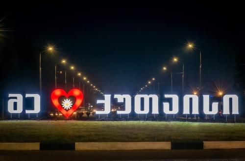 a large red heart in front of a large sign at Europa Hotel-Kutaisi in Kutaisi