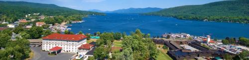 an aerial view of a town next to a lake at Fort William Henry Hotel in Lake George