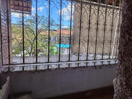 a window with a view of a street outside at Apto tipo Casa 10 com 2 quartos bem grande Praia da Costa Centro Ar Condicionado Internet Mobiliado Geladeira Fogao TV in Vila Velha