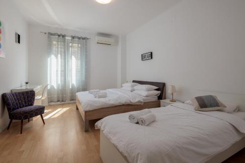 Posteľ alebo postele v izbe v ubytovaní Lux Split Centre Apartments