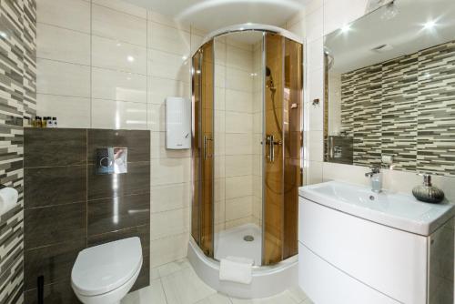 Koupelna v ubytování Pokoje, Apartamenty, Domki nad Morzem Dune Resort Łeba