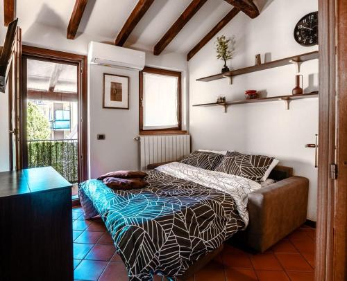 a small bedroom with a bed and a window at Oasi Piacentina in Piacenza