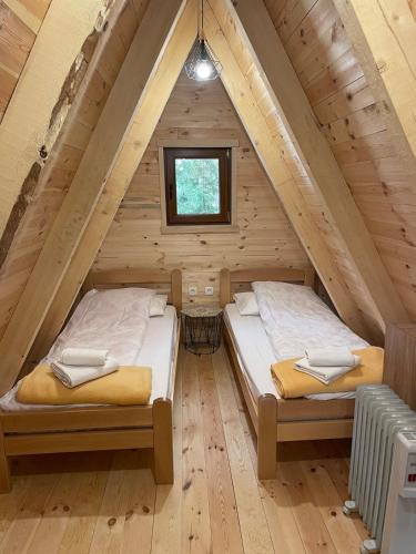 Ένα ή περισσότερα κρεβάτια σε δωμάτιο στο Vila Djordje Žabljak