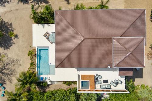 an overhead view of a house with a roof at Naïa Resort and Spa in Placencia Village