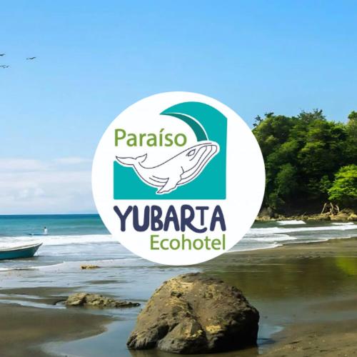 a white and green sign on a beach with a rock at Paraíso con playas vírgenes & selvas en "Nuqui" in Nuquí