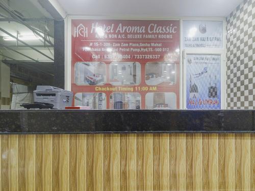 a restaurant counter with a sign above it at Hotel O Aroma Classic Near Nampally Railway station in Hyderabad