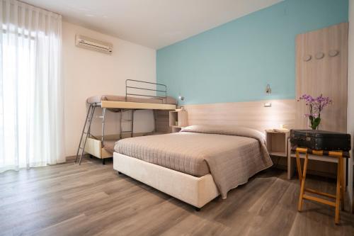 Postel nebo postele na pokoji v ubytování Hotel Marilinda