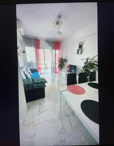 a living room with a couch and a table at Apartamento Alicia in Daimuz