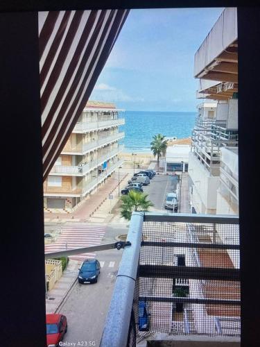 a view of the ocean from the balcony of a building at Apartamento Alicia in Daimuz