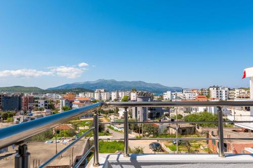 a view of a city from a balcony at Aleksander ApartHotel in Ksamil