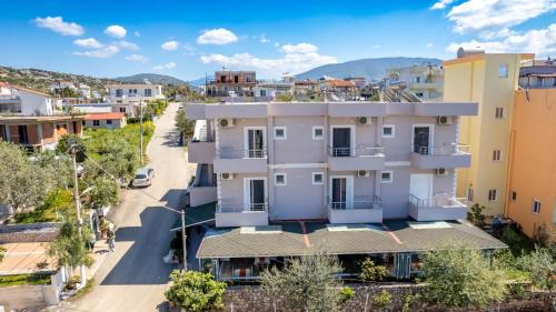 an aerial view of a building in a city at Aleksander ApartHotel in Ksamil