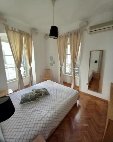 Decatera apartment tesisinde bir odada yatak veya yataklar