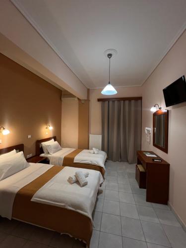 Postel nebo postele na pokoji v ubytování Hotel Nevada Kalamata