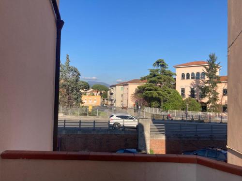 a view of a parking lot from a window at Emerald Room Pisa in Pisa