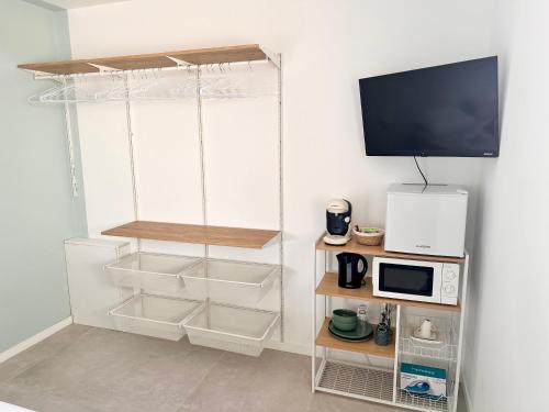 Photo de la galerie de l'établissement Chambre avec coin repas & fitness, à Beynost