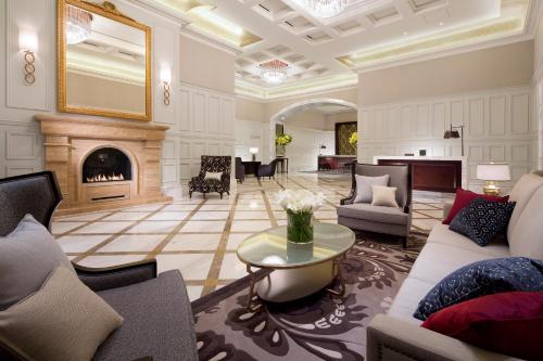 a living room filled with furniture and a fire place at The Tokyo Station Hotel in Tokyo