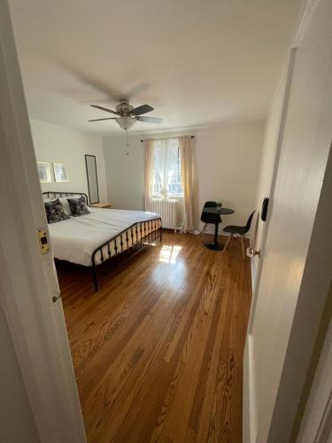 a bedroom with a bed and a ceiling fan at The Ambassador in Ottawa