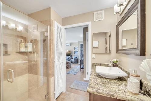 a bathroom with a sink and a shower at Hale Kahana'lu in Koloa