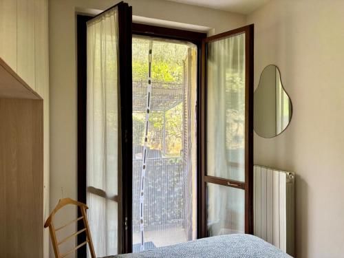 Postel nebo postele na pokoji v ubytování Casa Vacanza Monalba sul lago d'Iseo
