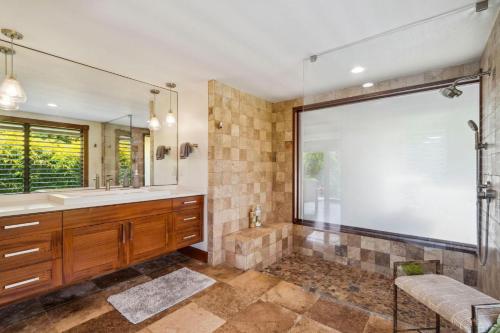 a bathroom with a shower and a large window at Kapiolani - As seen on HGTV in Princeville