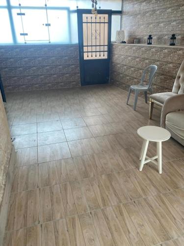 a living room with a table and a couch at Amman Apartment 123 in Amman