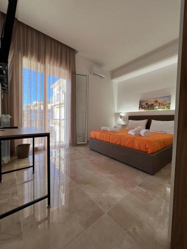 Postel nebo postele na pokoji v ubytování Isgró B&B