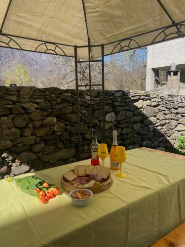 a table with a plate of food and drinks on it at Nonna Amelia in Pontegrande