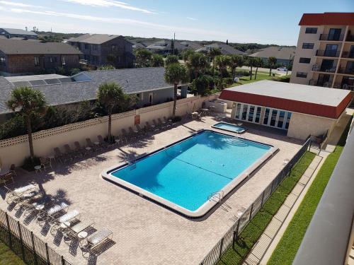 an overhead view of a swimming pool on a building at 409 - 2/2 Stunning Condo Ocean View in New Smyrna Beach