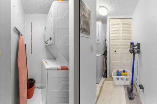 a laundry room with a washer and a white refrigerator at Charming 2-Bedroom, 2-Bath Condo with Golf Course Views in Isla Del Sol in Point Brittany