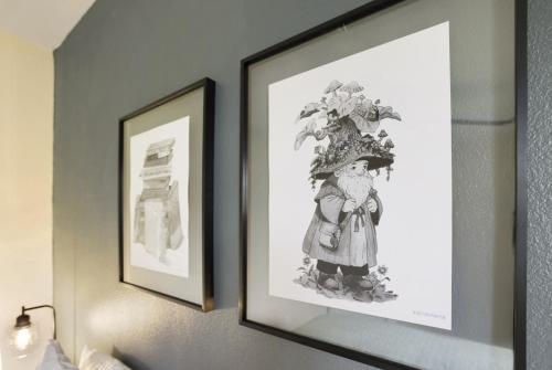 two framed pictures of a girl on a wall at 4 bedroom Private House in central Chico in Chico