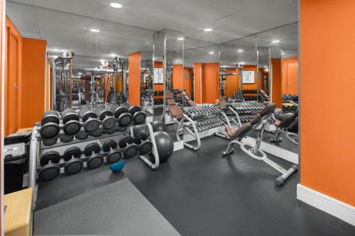 a gym with lots of machines and weights at Crowne Plaza London Ealing by IHG in London