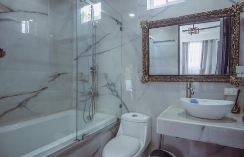 a bathroom with a toilet and a sink and a shower at Deluxe beach house in Westfalia