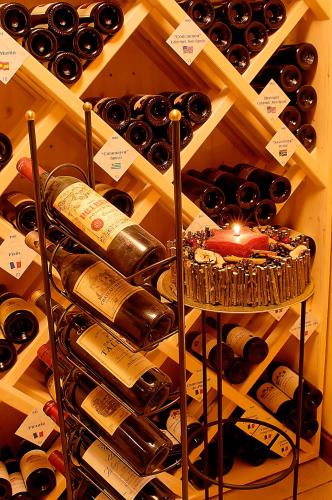 a bunch of bottles of wine in a cellar at Hotel Spinne Grindelwald in Grindelwald