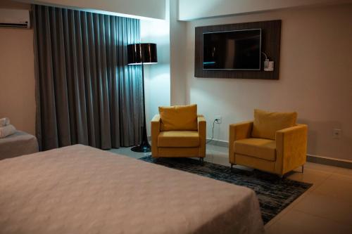 TV a/nebo společenská místnost v ubytování Ipe Center Hotel