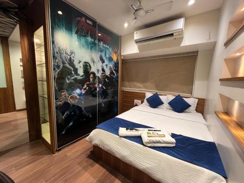 a bedroom with a movie poster on the wall at Zenith Luxe Suites - Near IIT & Hiranandani, Powai in Mumbai