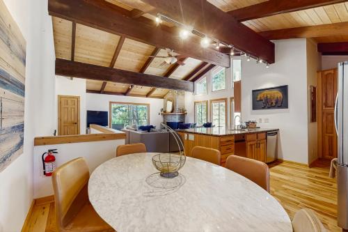 a kitchen and dining room with a table and chairs at Retreat at Oriole Way in Incline Village