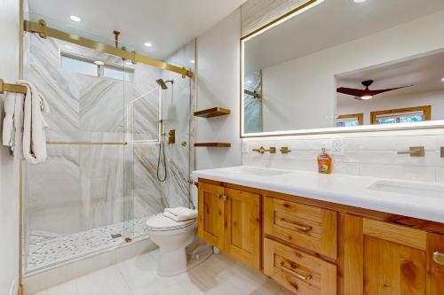 a bathroom with a shower and a sink and a toilet at Retreat at Oriole Way in Incline Village