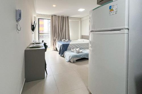 Quartz Residence Intermares Flat 3 pessoasにあるベッド