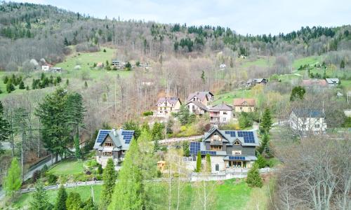 an aerial view of a house with solar panels on it at Family Relax Widoki in Szczyrk