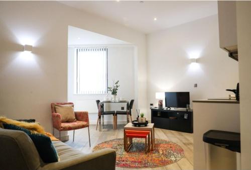 a living room with a couch and a table at Urban Living I Free Parking in Slough