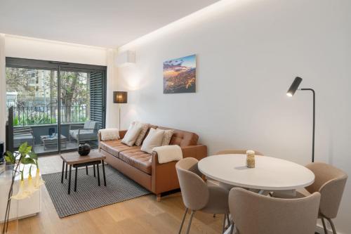a living room with a couch and a table at With pool in Funchal - Acqua Residence V in Funchal