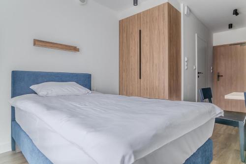Postel nebo postele na pokoji v ubytování Noli Gdansk Wrzeszcz