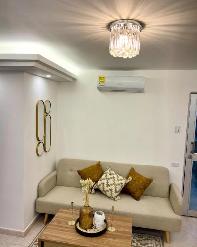 a living room with a couch and a table at Hotel Casablanca in Galapa