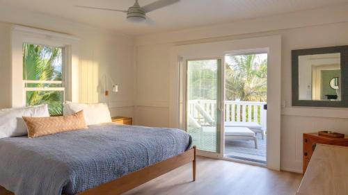 Postel nebo postele na pokoji v ubytování Hale Kalani