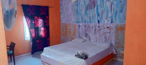 Ein Bett oder Betten in einem Zimmer der Unterkunft Chez Paolo