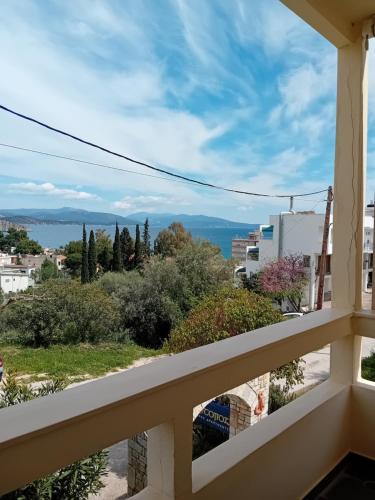 a balcony with a view of the ocean at Heliotopos Apartments in Tolo